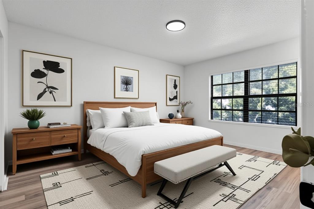 2722 Graduate Court Orlando, FL 32826 - Photo 15 of 33 a bedroom with a bed and a window