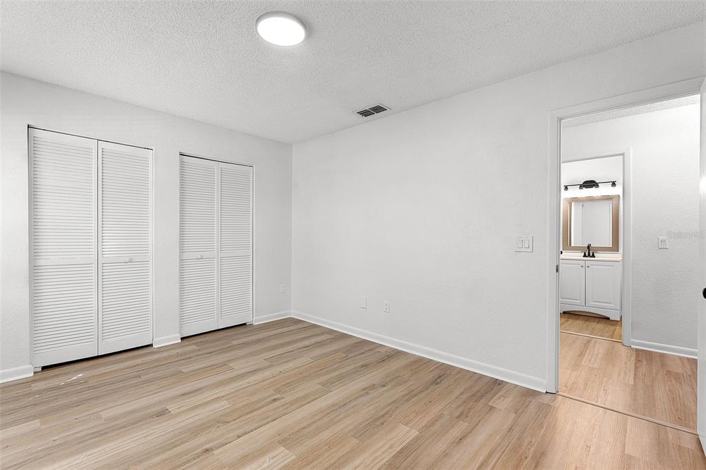 2722 Graduate Court Orlando, FL 32826 - Photo 23 of 33 wooden floor in an empty room