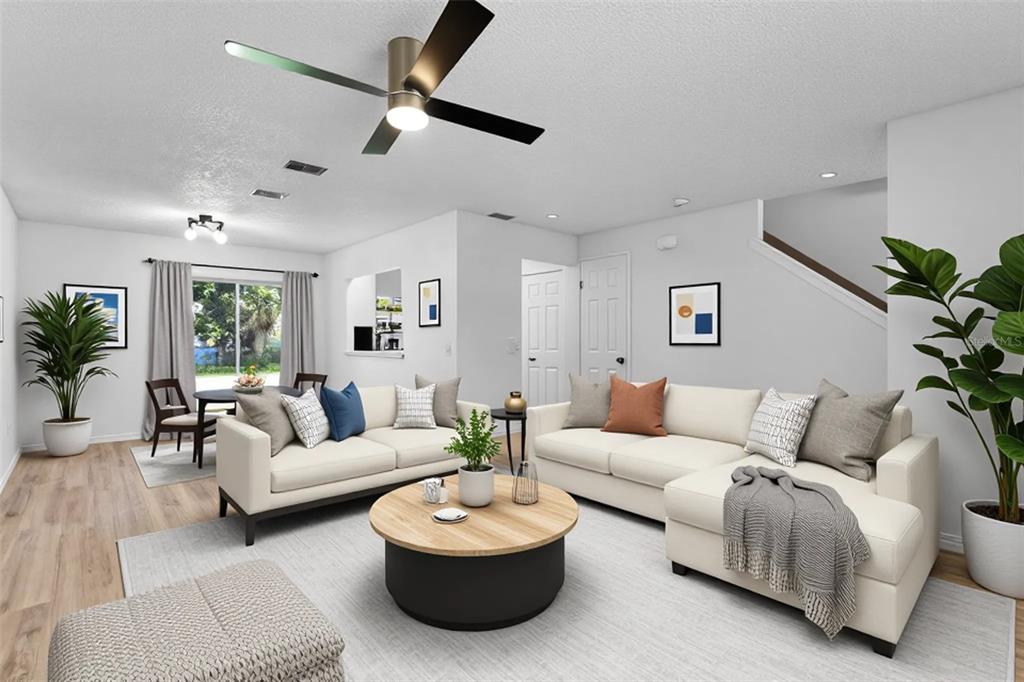 2722 Graduate Court Orlando, FL 32826 - Photo 6 of 33 a living room with furniture and a large window