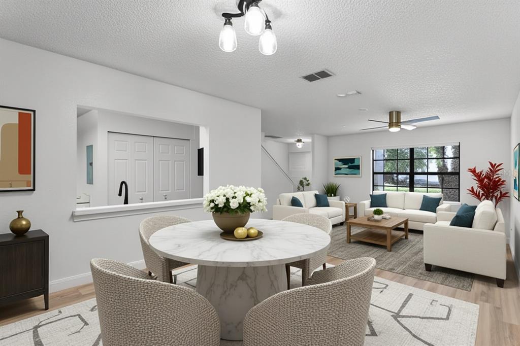 2722 Graduate Court Orlando, FL 32826 - Photo 8 of 33 a living room with furniture and a wooden floor