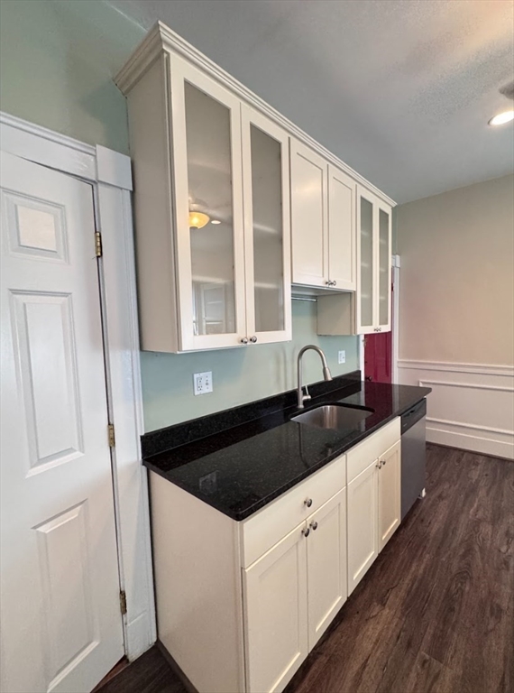 401 Washington Street, Unit 3 Cambridge, MA 02139 - Photo 3 of 13 a kitchen with granite countertop a sink and cabinets