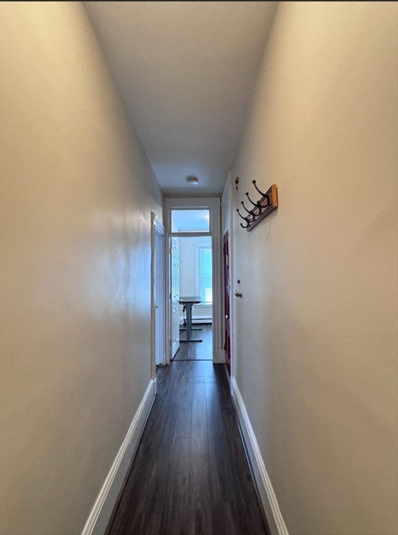 401 Washington Street, Unit 3 Cambridge, MA 02139 - Photo 10 of 13 a view of a hallway with wooden floor