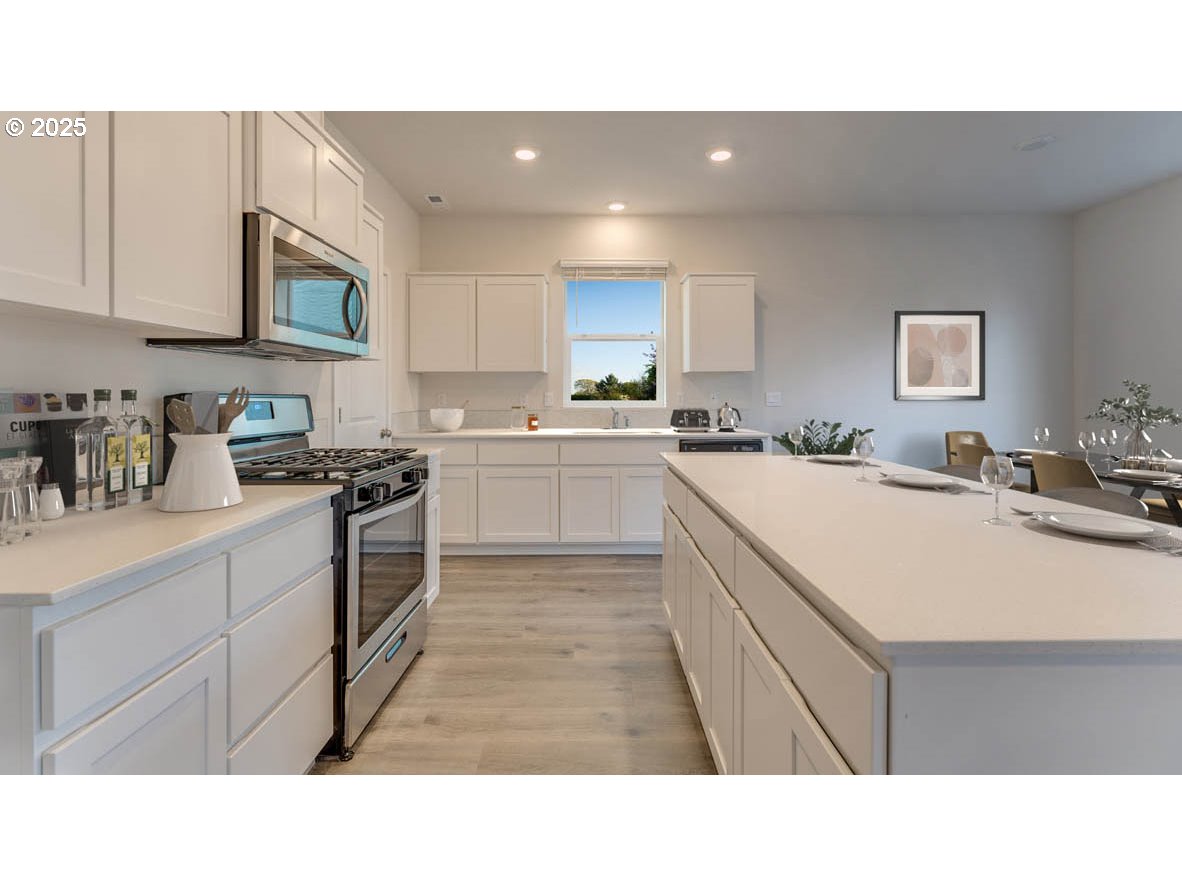 2960 T Street Springfield, OR 97477 - Photo 5 of 9 a kitchen with a sink window and stainless steel appliances