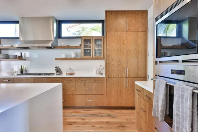 a view of a dining room with furniture large window and wooden floor