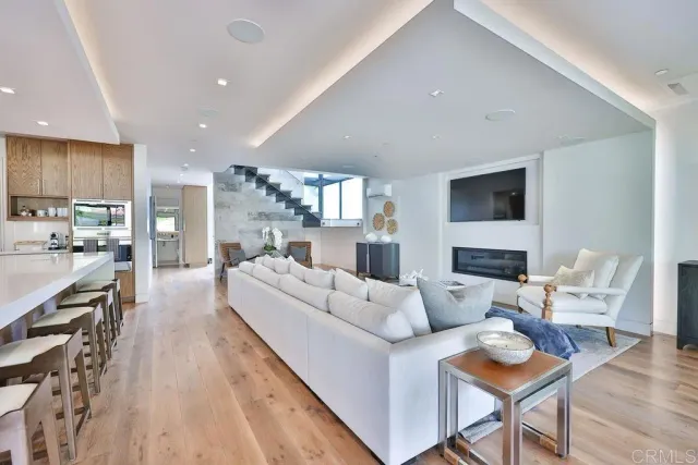 a large kitchen with a table and chairs
