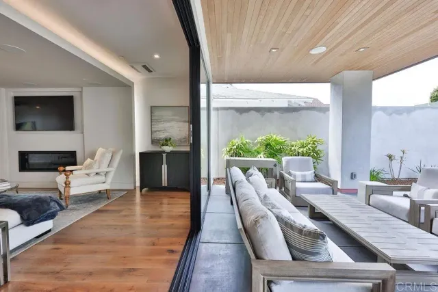 a view of house with outdoor space and sitting area