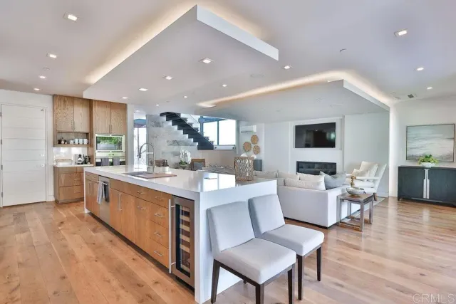 a bedroom with a large bed and a dresser