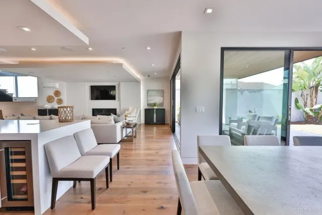 a bedroom with furniture and a wooden floor