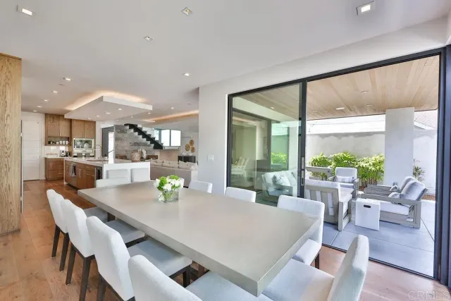 a bedroom with furniture and a flat screen tv