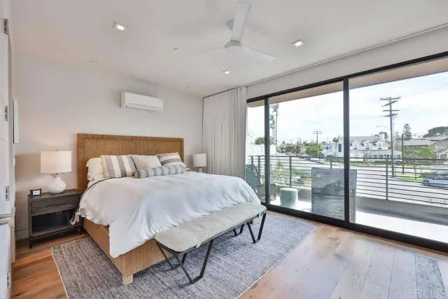 a view of walk in closet with clothes