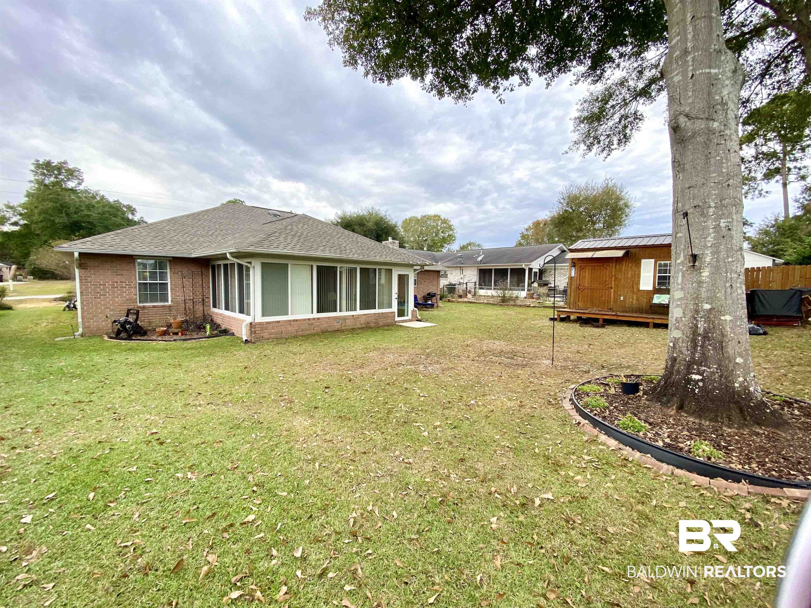2872 Avenida Alberto Lillian, AL 36549 - Photo 7 of 31 View of yard featuring a shed