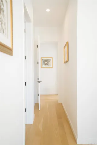 a large bed sitting in a bedroom next to a window