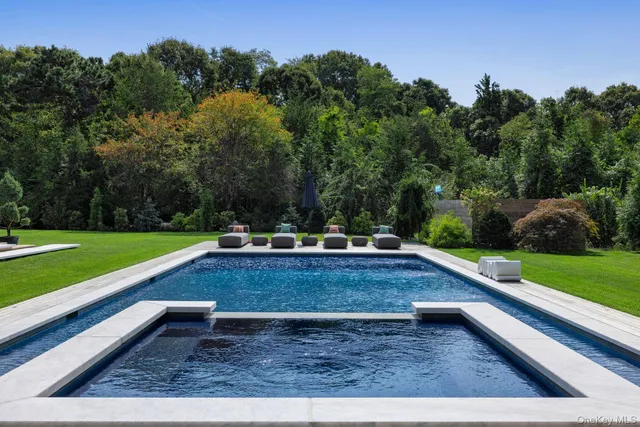 a view of a yard with large trees