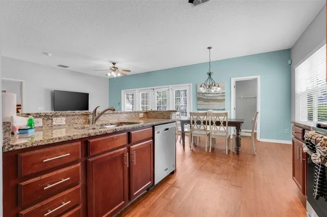 a large kitchen with lots of counter space a sink and appliances