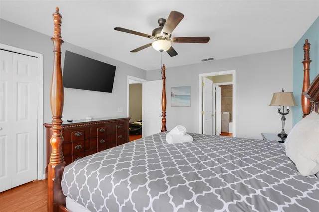 a bathroom with a granite countertop sink a mirror and shower
