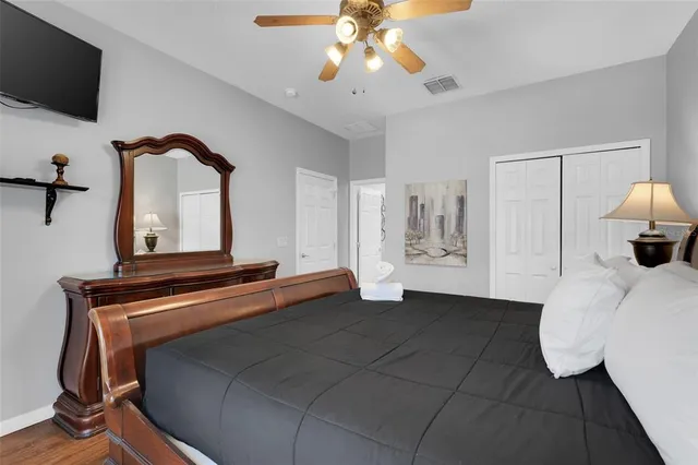 a bedroom with a bed and a chandelier
