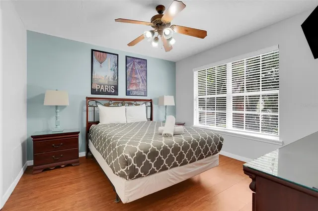 a bathroom with a granite countertop sink a light fixture and a mirror