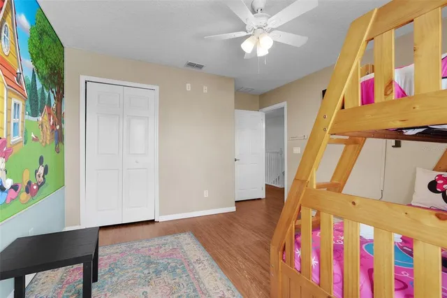 a bathroom with a toilet a sink and a mirror