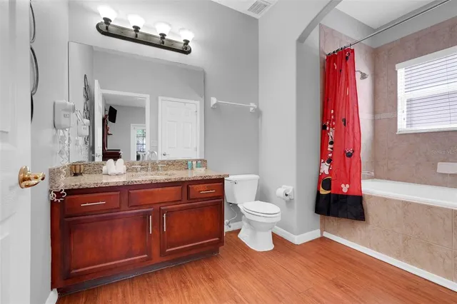 a bedroom with bed and window