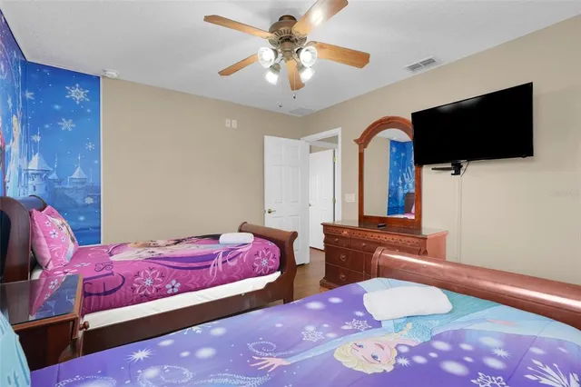 a bathroom with a toilet and a shower curtain