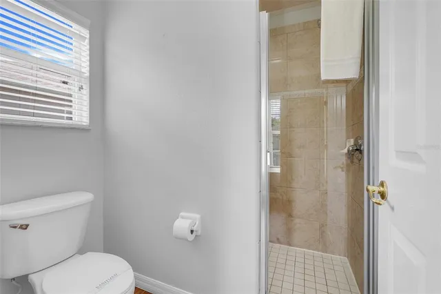 a living room with furniture a rug and a chandelier