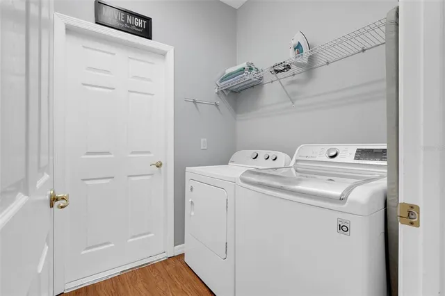 a view of a dining room with furniture and window