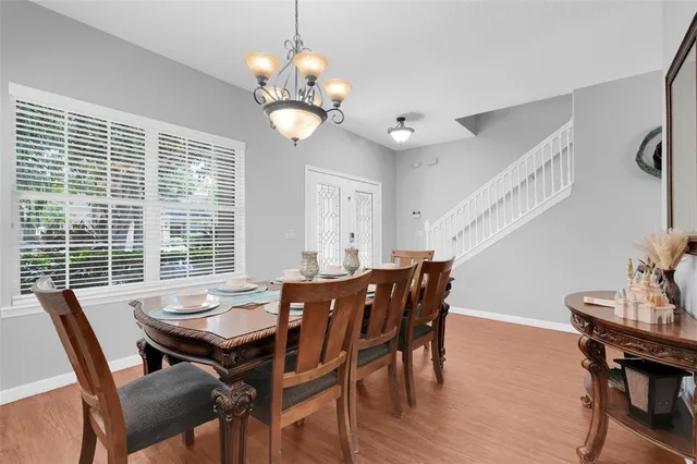 a view of a dining room with furniture window and wooden floor