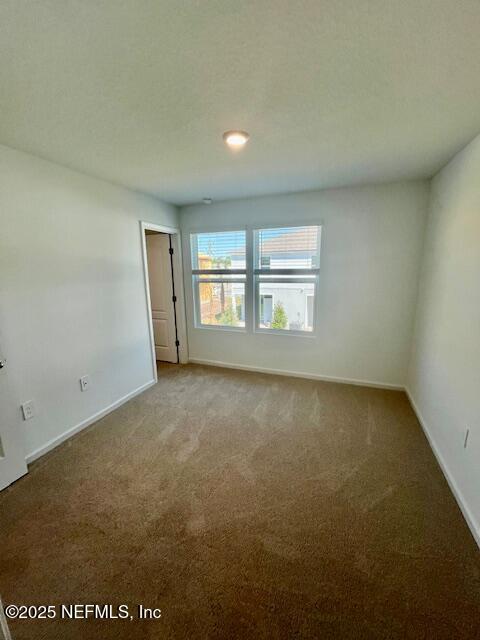 73 Hidden Mdws Road St. Augustine, FL 32095 - Photo 15 of 25 an empty room with windows