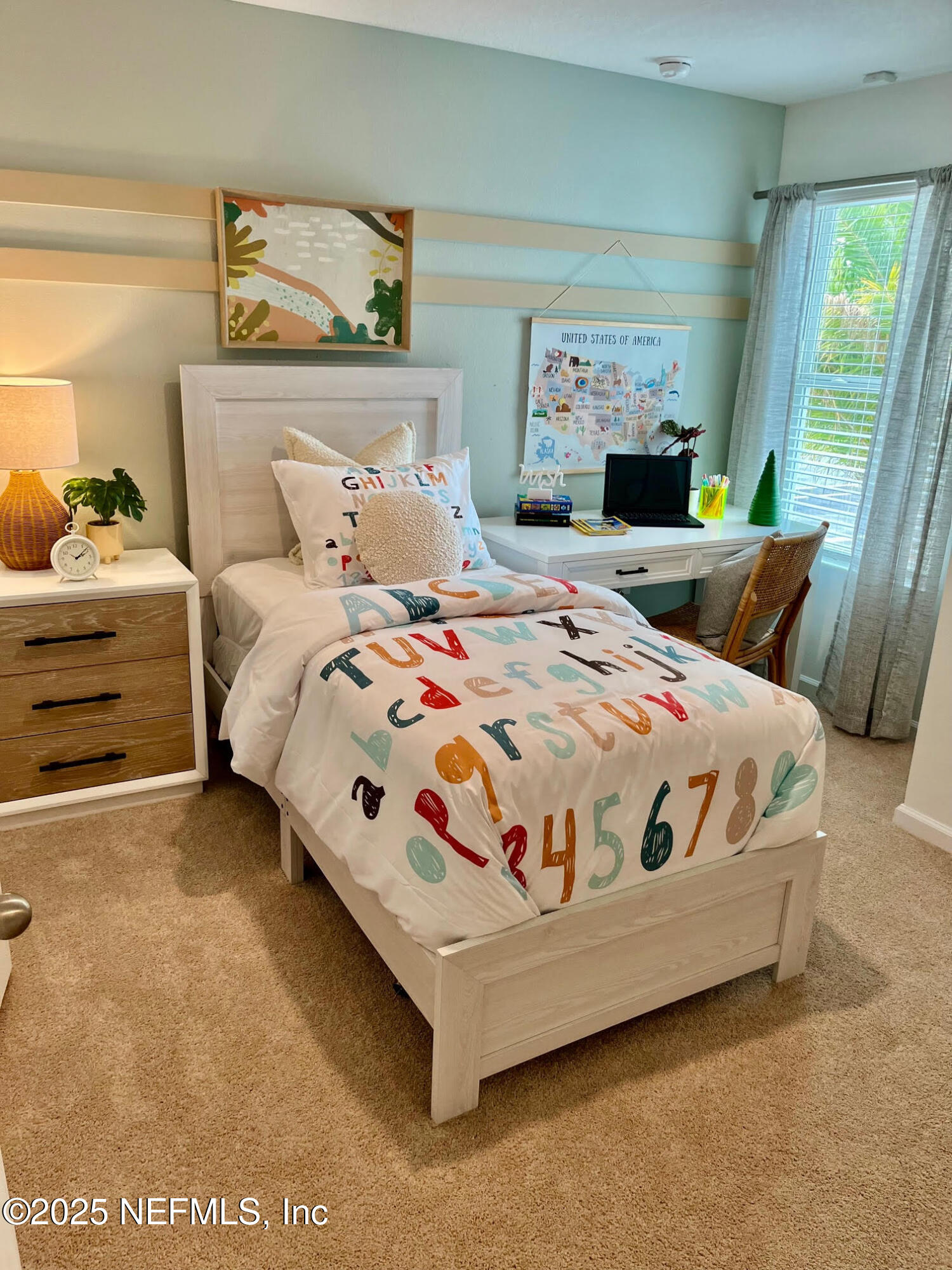 73 Hidden Mdws Road St. Augustine, FL 32095 - Photo 19 of 25 a bedroom with a bed next to a window