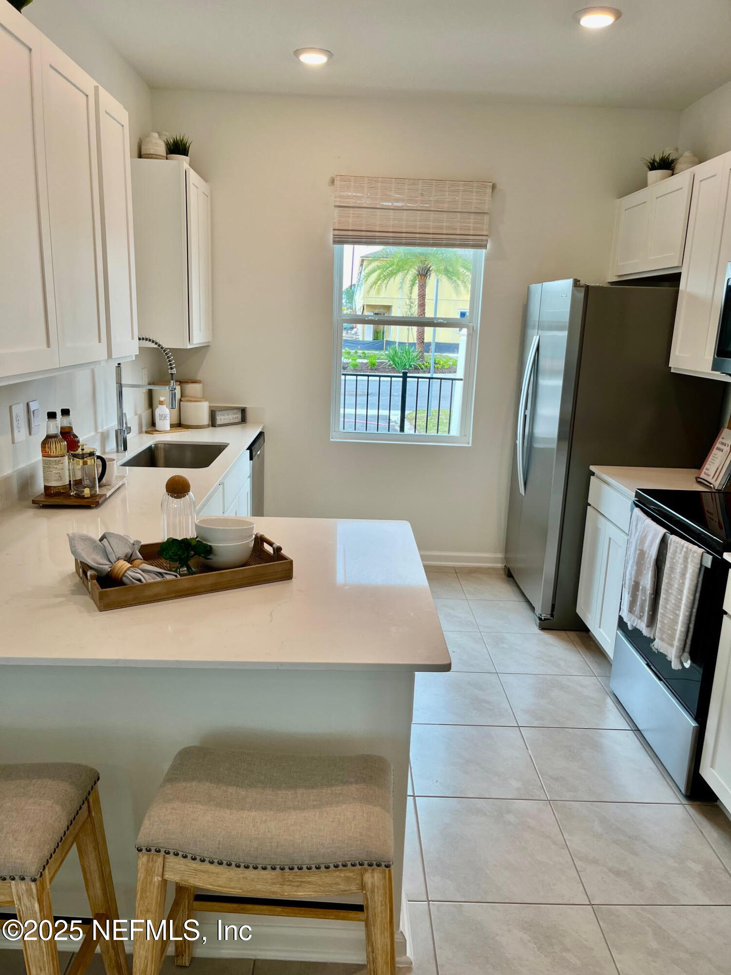 73 Hidden Mdws Road St. Augustine, FL 32095 - Photo 2 of 25 a kitchen with a sink appliances and a window