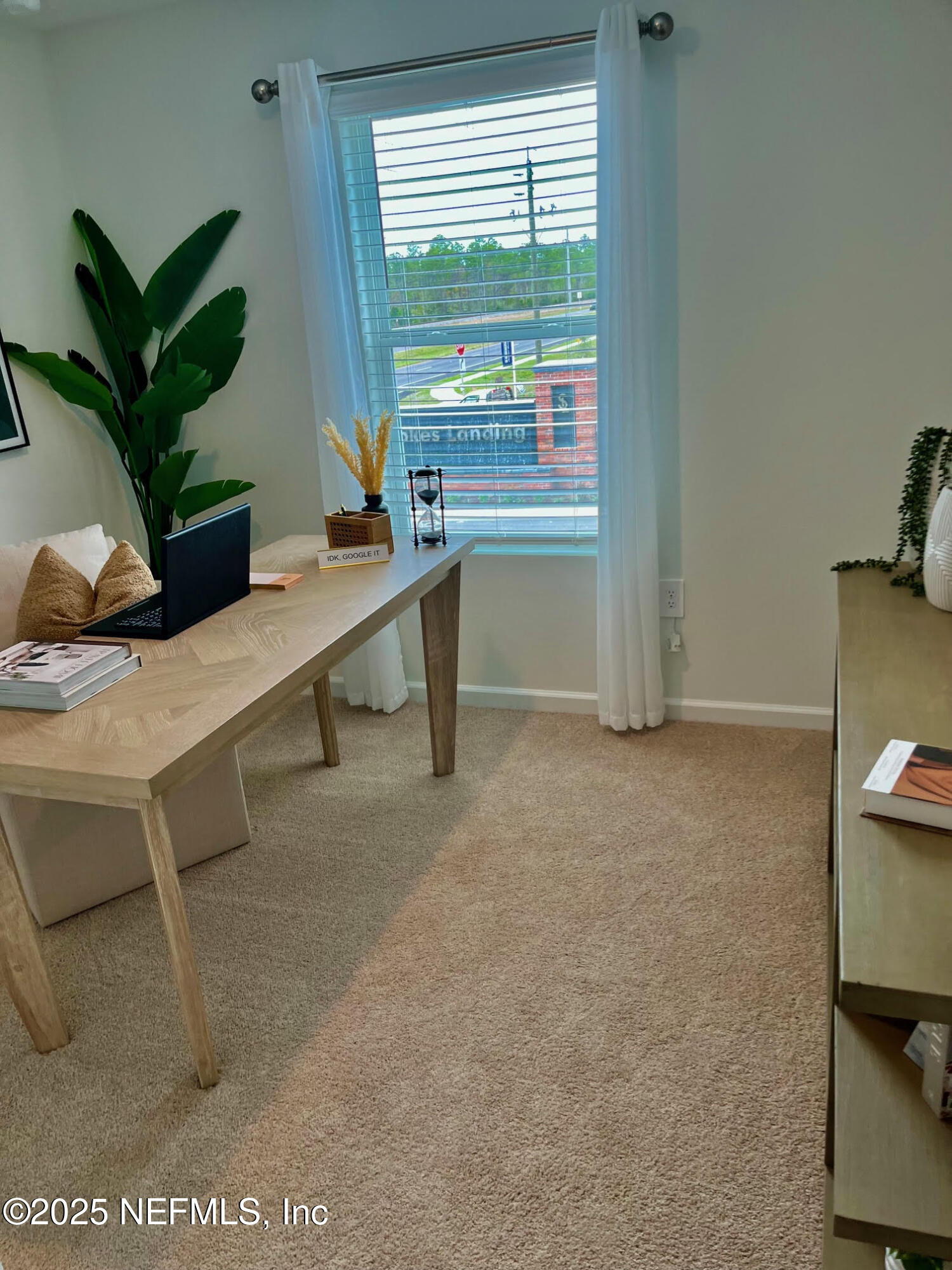 73 Hidden Mdws Road St. Augustine, FL 32095 - Photo 21 of 25 a view of a workspace with a window