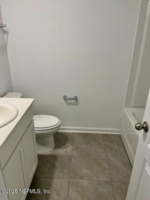 73 Hidden Mdws Road St. Augustine, FL 32095 - Photo 23 of 25 a white toilet sitting next to a white sink