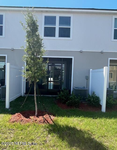 73 Hidden Mdws Road St. Augustine, FL 32095 - Photo 24 of 25 a front view of a house with garden