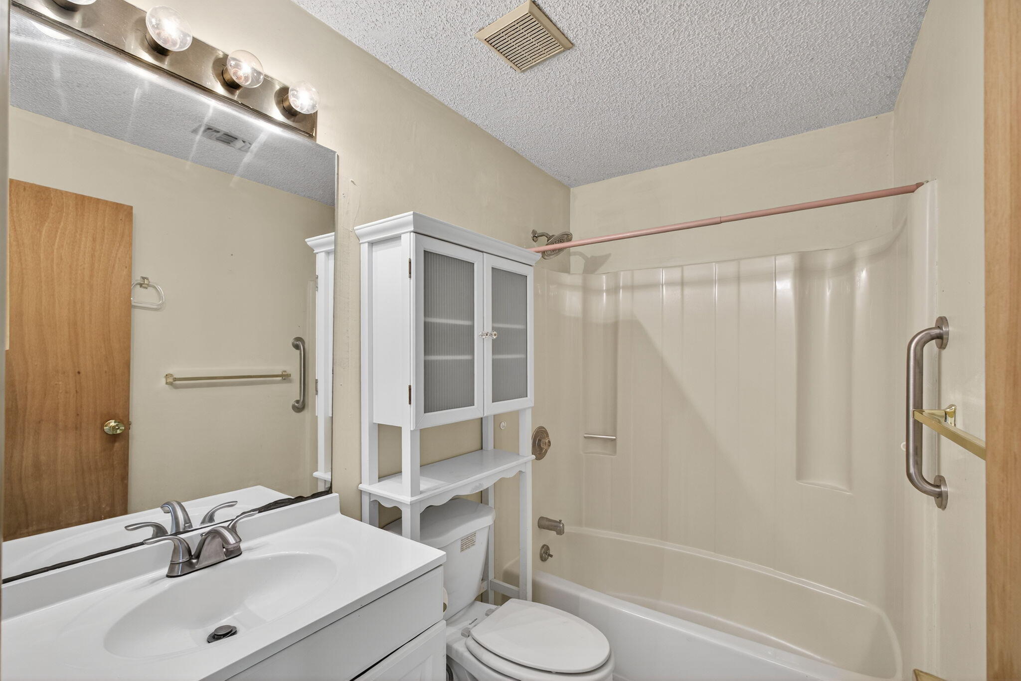 1332 West 33rd Street Riviera Beach, FL 33404 - Photo 15 of 25 a bathroom with a sink toilet and shower