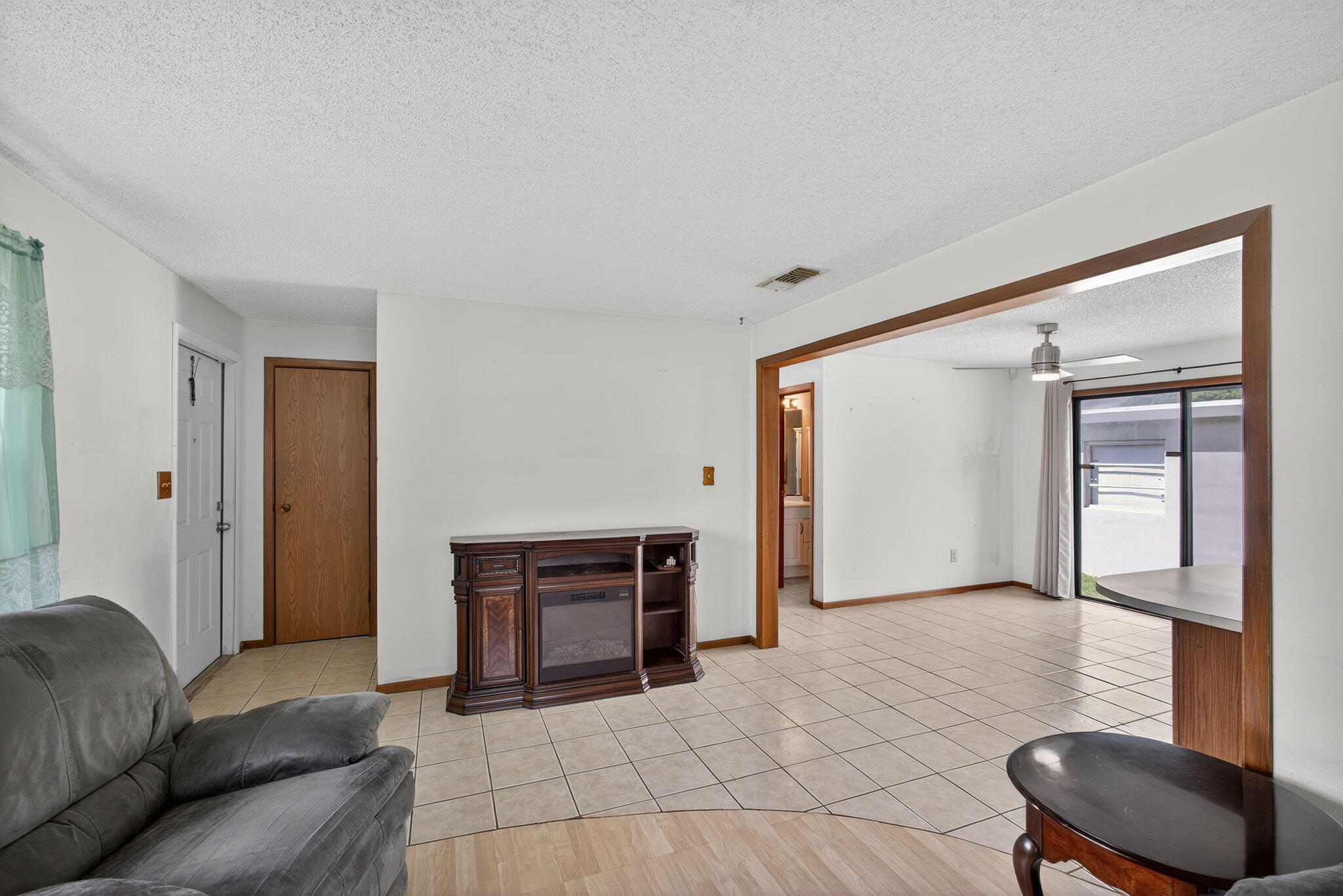 1332 West 33rd Street Riviera Beach, FL 33404 - Photo 5 of 25 a living room with furniture and a fireplace