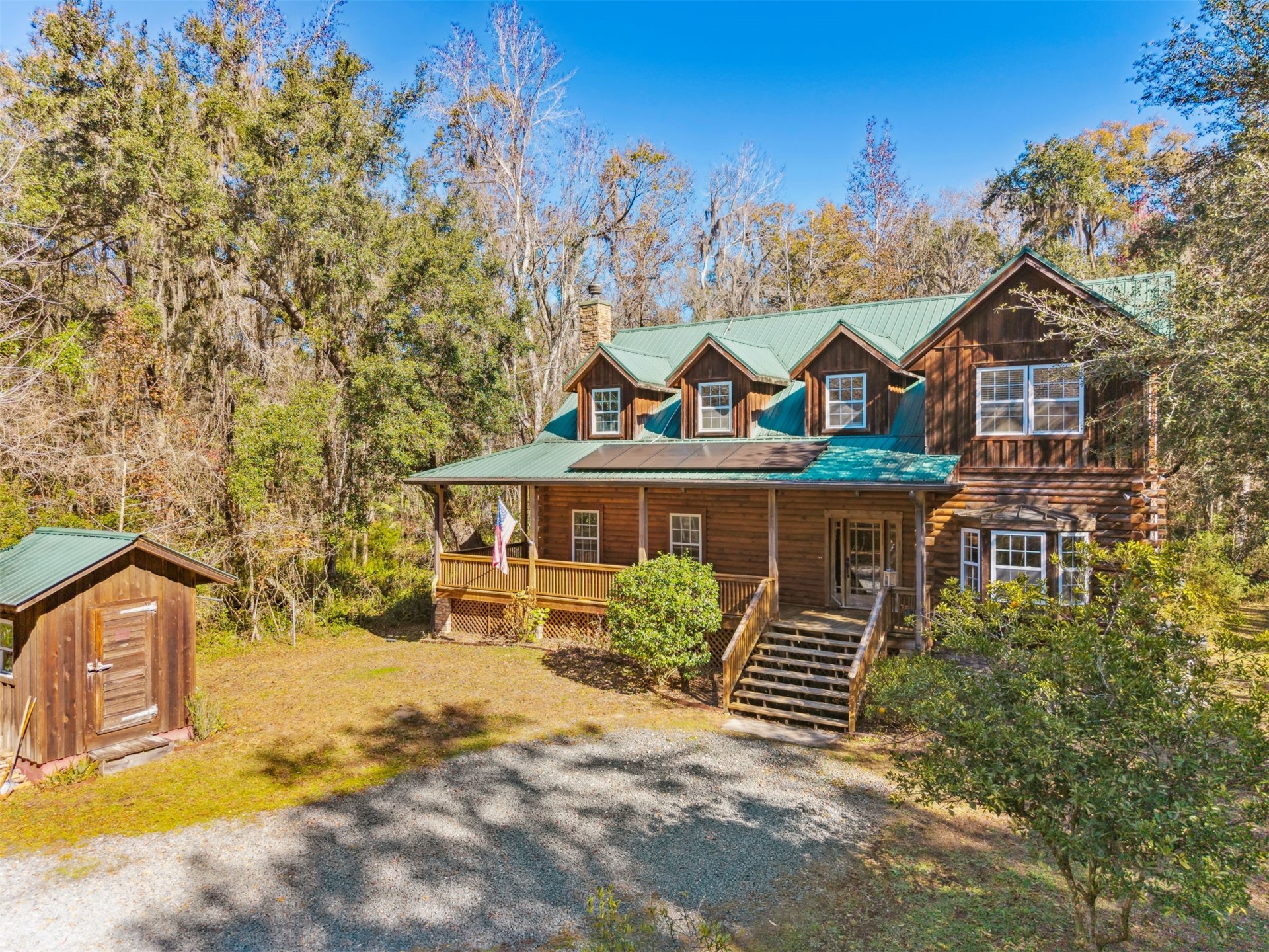 86205 Pages Dairy Road Yulee, FL 32097 - Photo 51 of 56 a front view of a house with garden