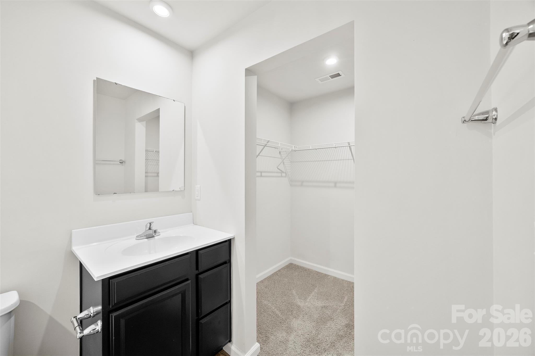 708 Dillon Way Fort Mill, SC 29715 - Photo 17 of 26 a bathroom with a sink and a mirror