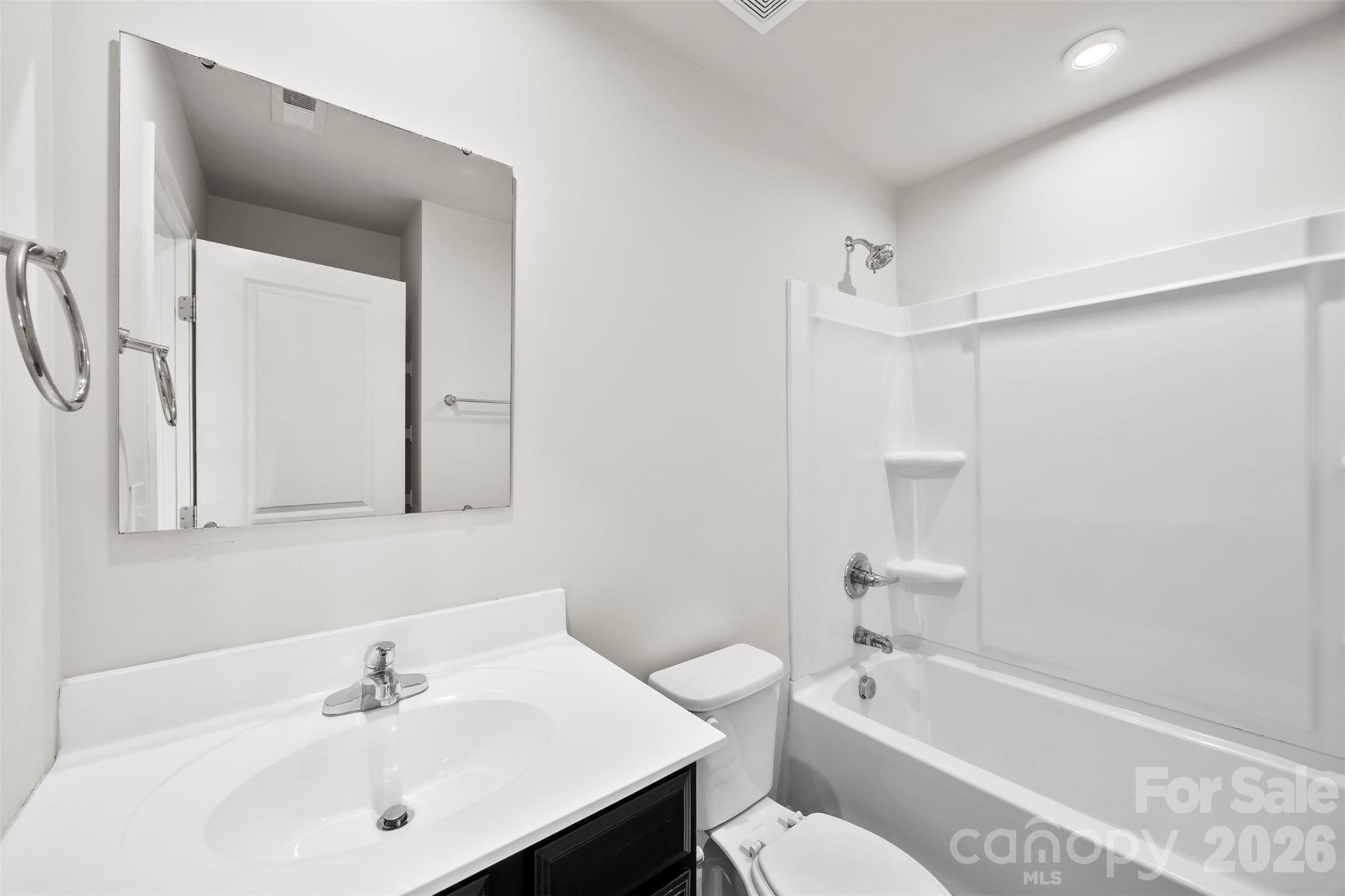 708 Dillon Way Fort Mill, SC 29715 - Photo 19 of 26 a bathroom with a sink a toilet and shower