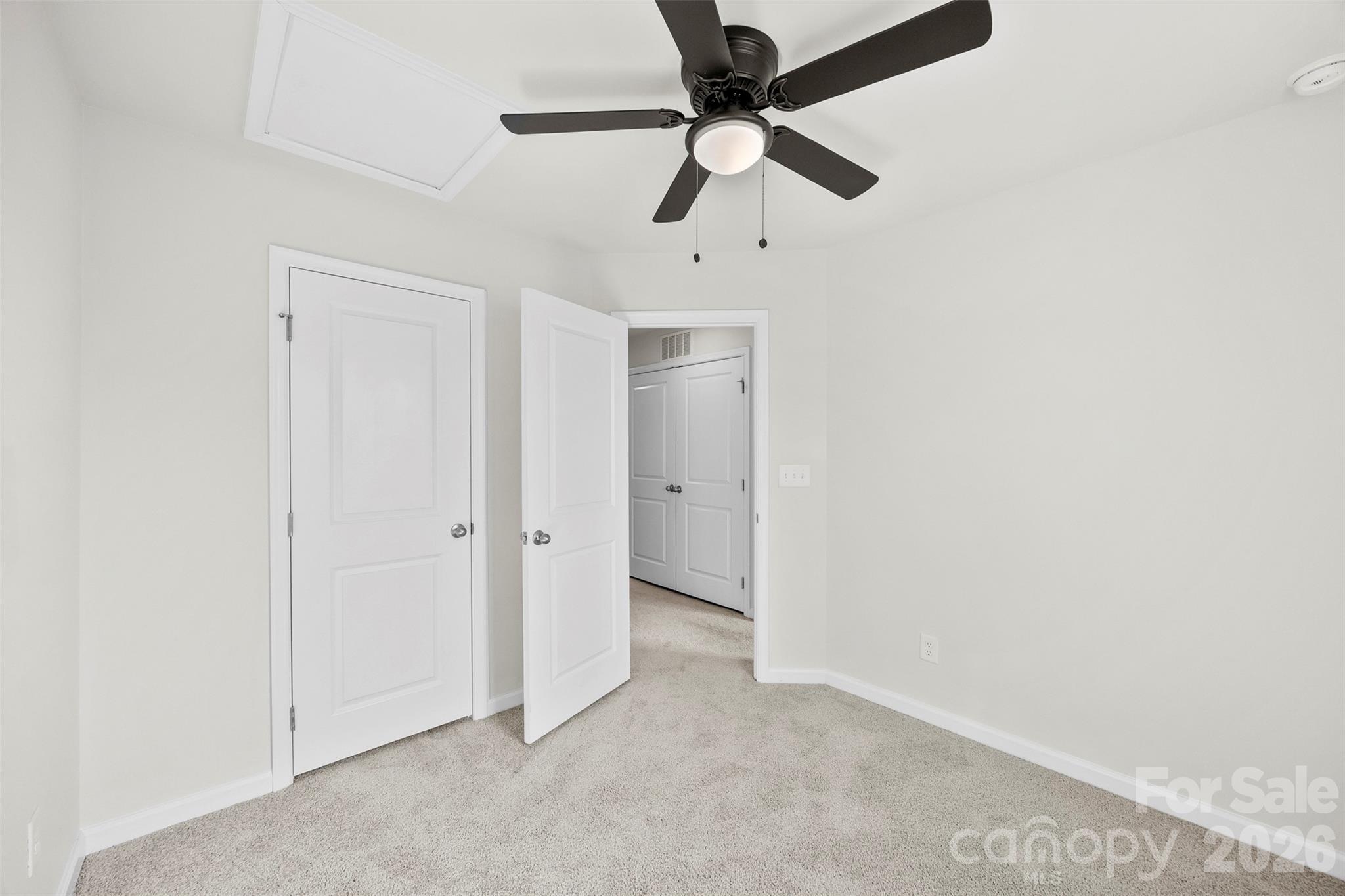 708 Dillon Way Fort Mill, SC 29715 - Photo 22 of 26 an empty room with a ceiling fan and carpet