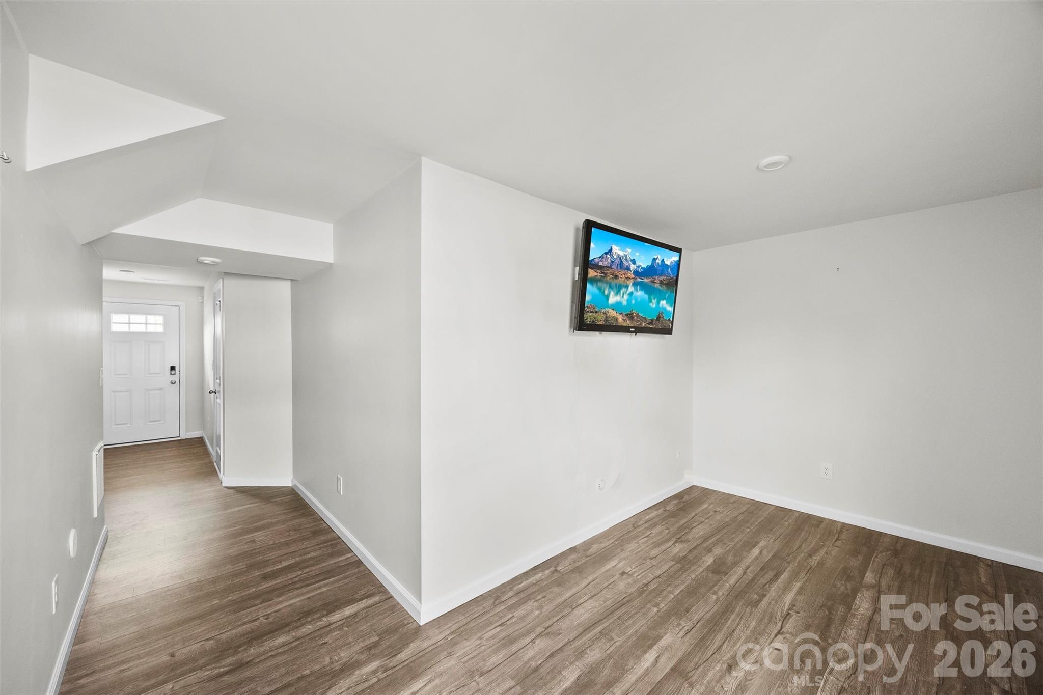 708 Dillon Way Fort Mill, SC 29715 - Photo 5 of 26 a view of a hallway with wooden floor