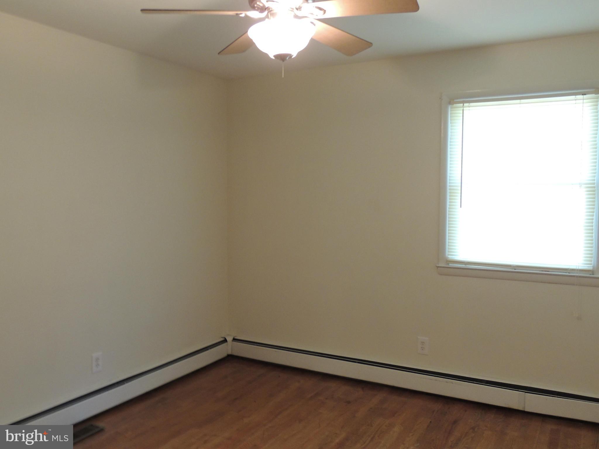 1321 Spring Avenue Baltimore, MD 21237 - Photo 8 of 27 an empty room with a window