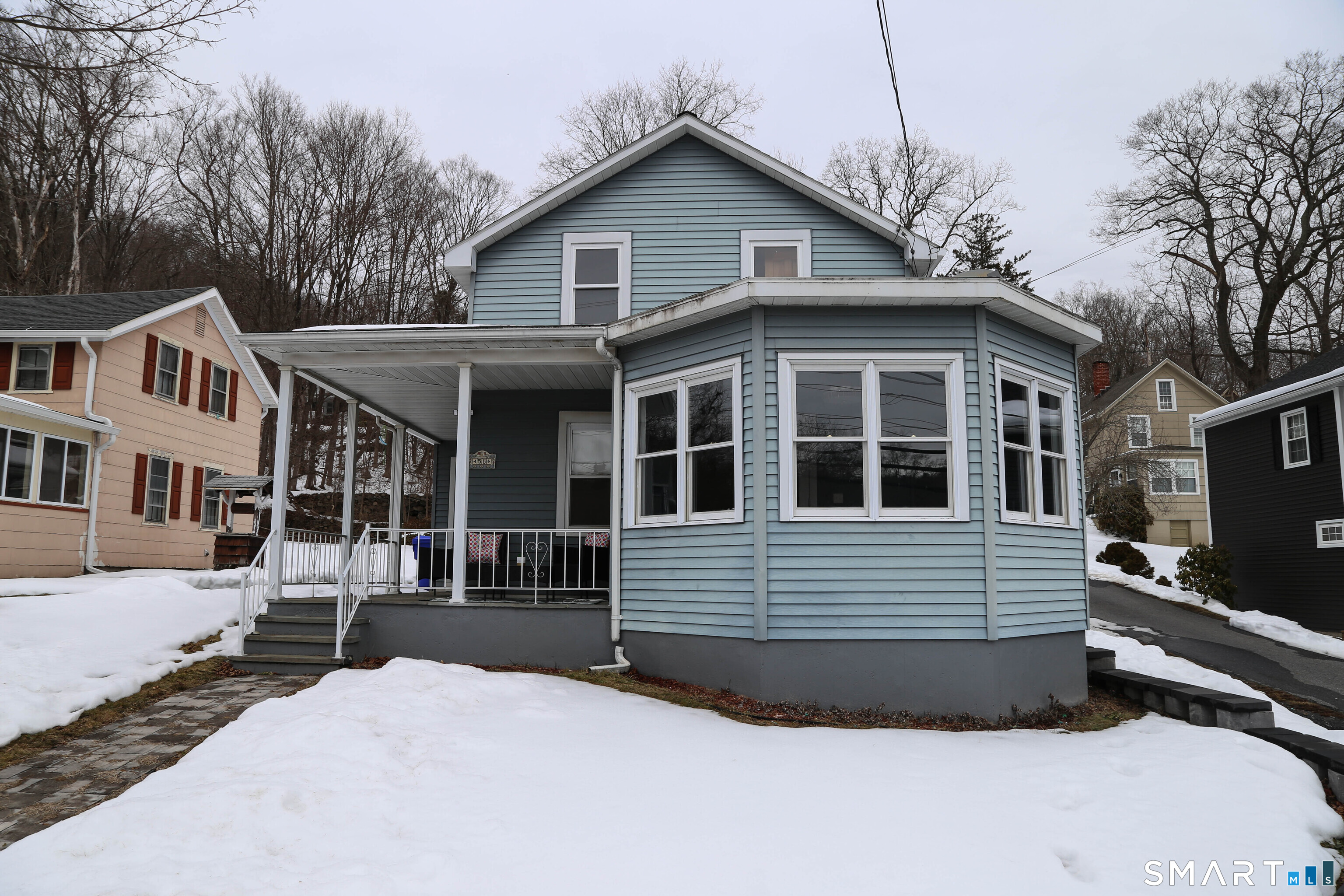 58 Litchfield Street Thomaston, CT 06787 - Photo 1 of 1 a front view of a house with a yard