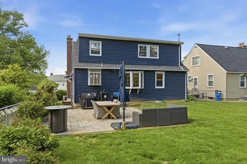 an aerial view of house with yard swimming pool and outdoor seating