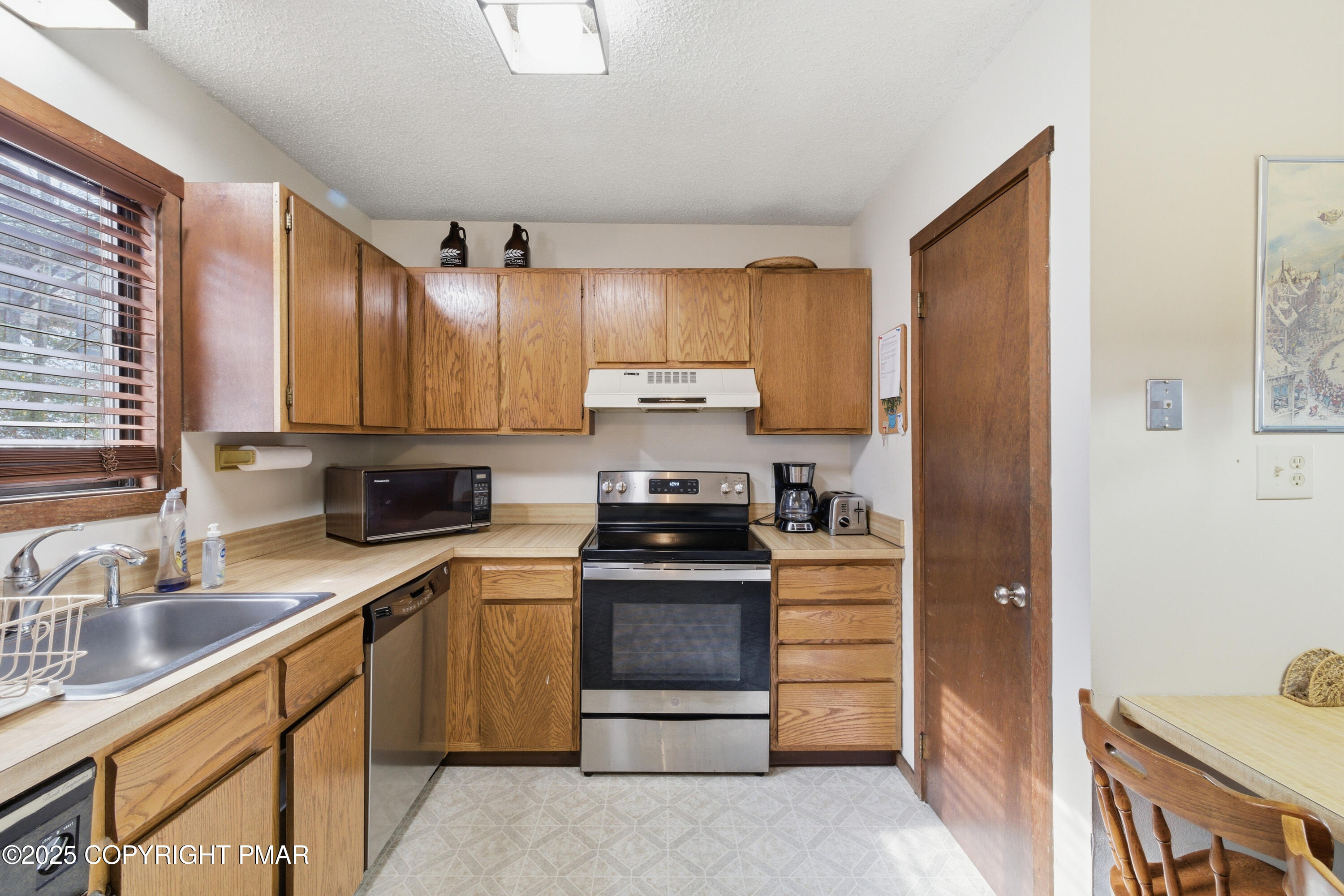 182 Upper Village Way Tannersville, PA 18372 - Photo 12 of 67 a kitchen with a stove sink and refrigerator