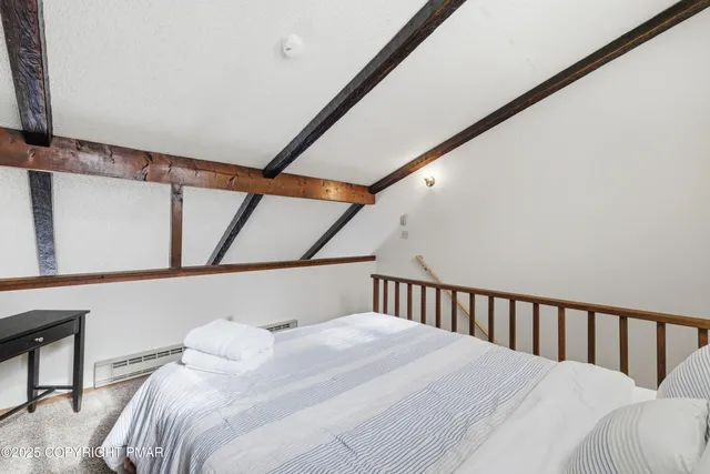 a bathroom with a sink toilet a mirror and shower
