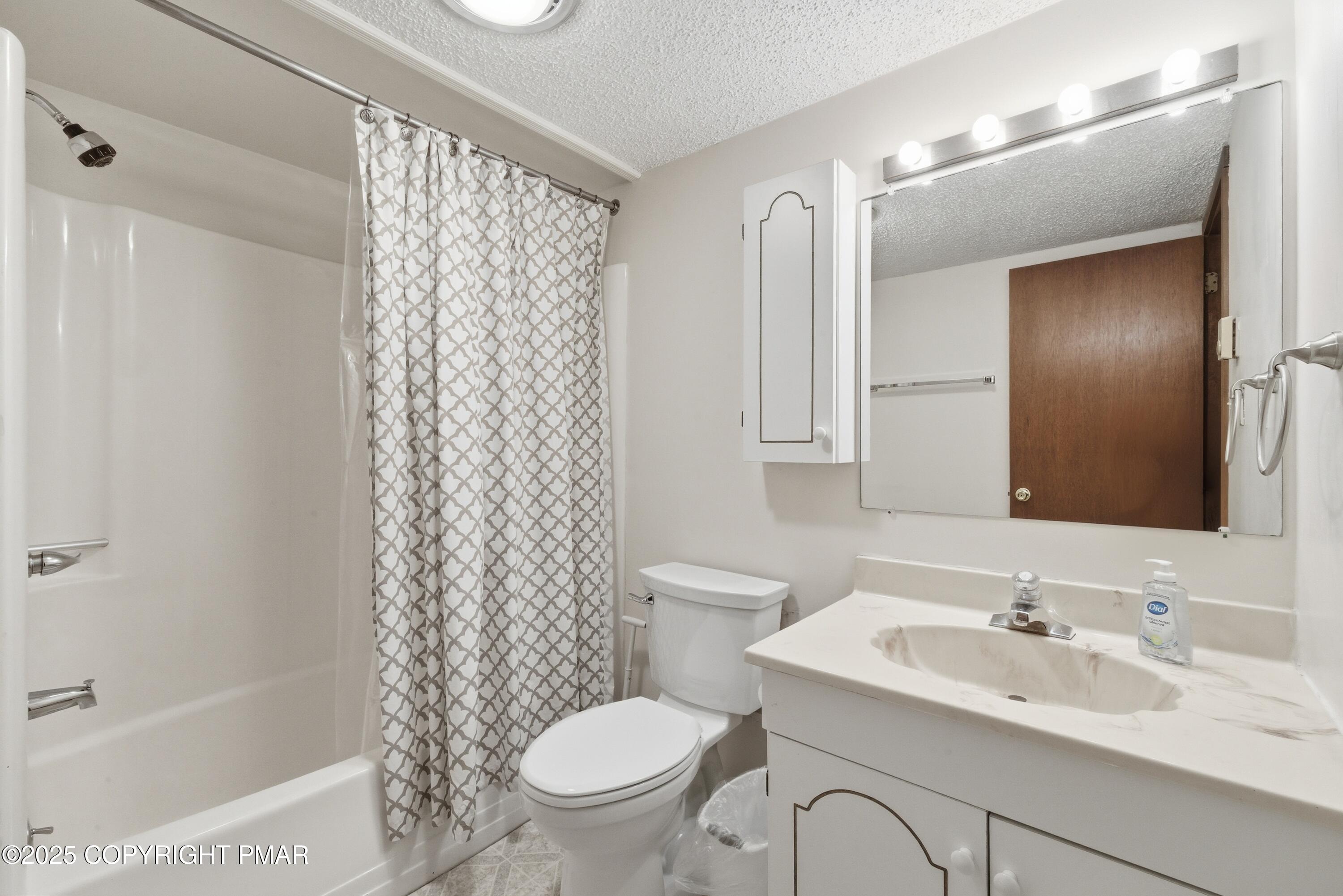 182 Upper Village Way Tannersville, PA 18372 - Photo 25 of 67 a bathroom with a sink toilet a mirror and shower