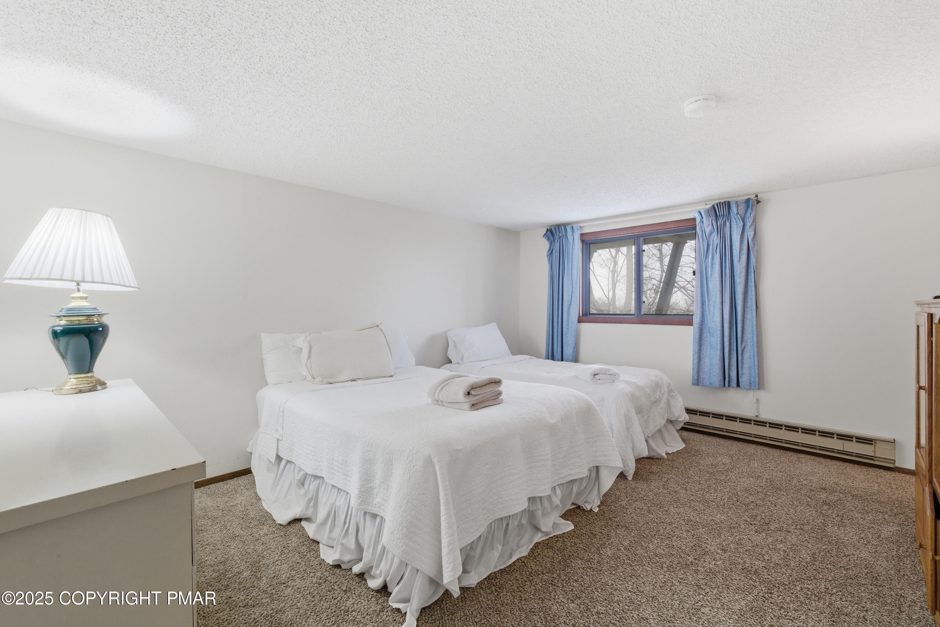 182 Upper Village Way Tannersville, PA 18372 - Photo 26 of 67 a large white bed in a white room