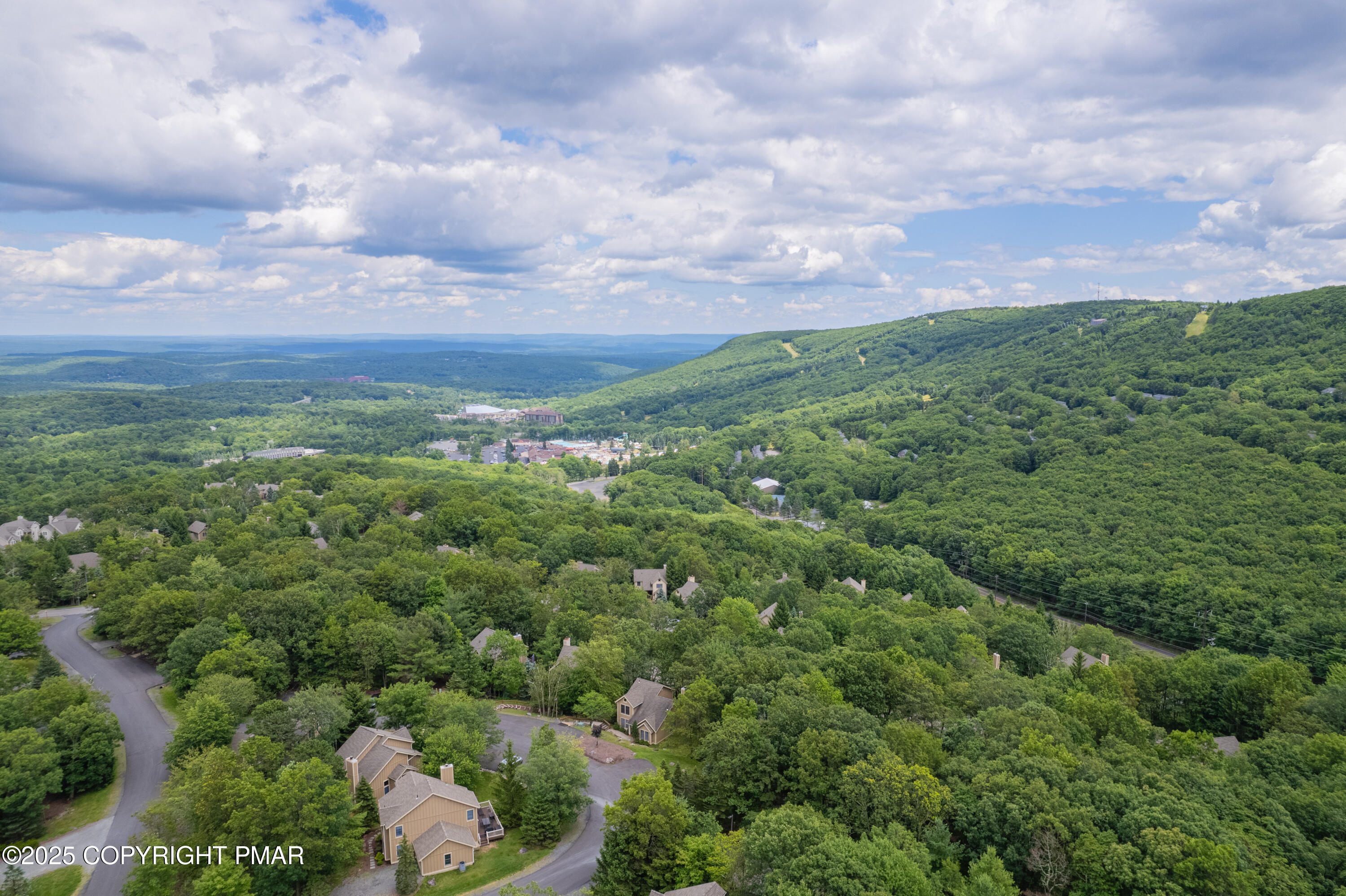 182 Upper Village Way Tannersville, PA 18372 - Photo 43 of 67 a view of a city with lush green forest