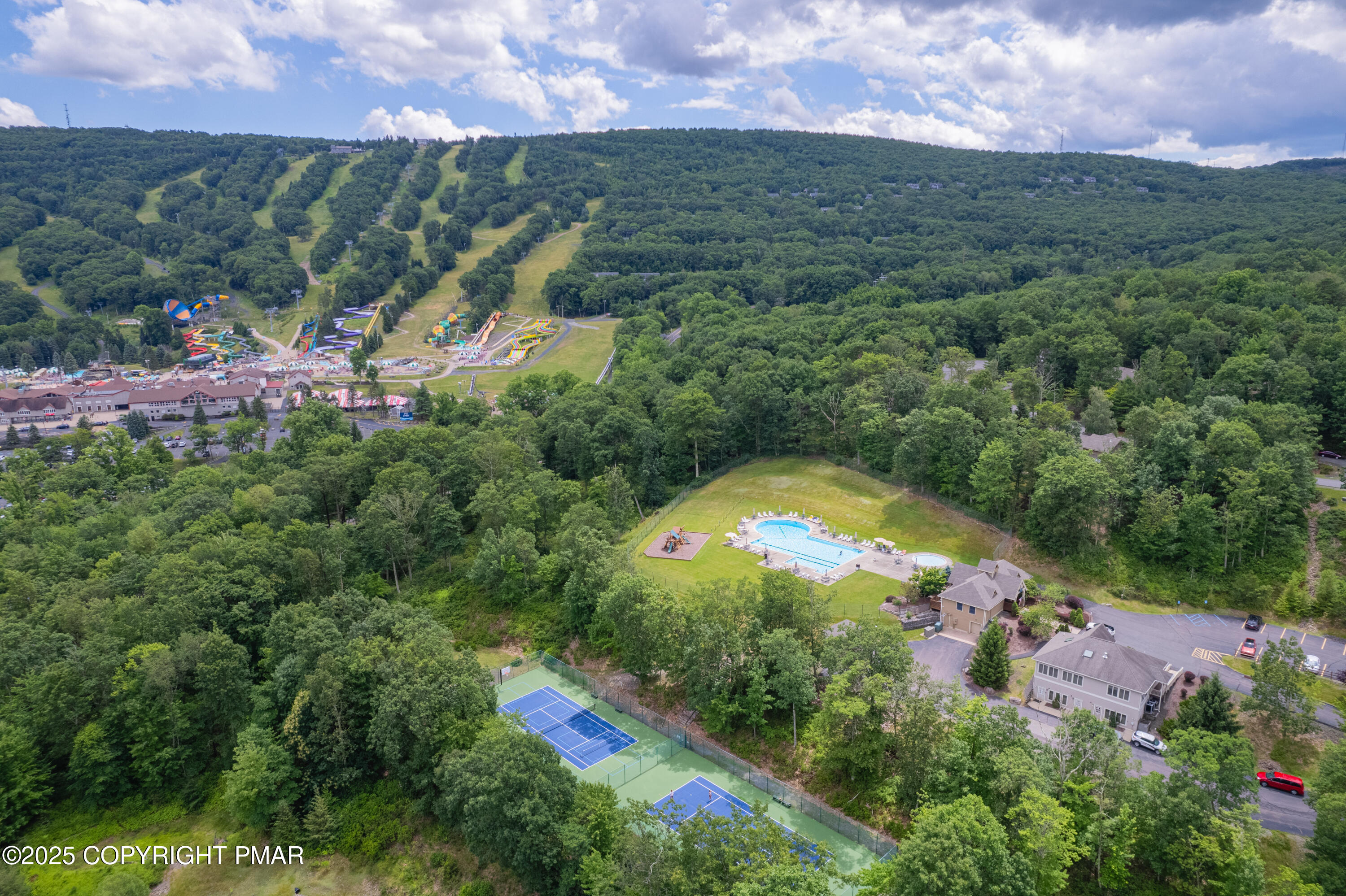 182 Upper Village Way Tannersville, PA 18372 - Photo 45 of 67 an aerial view of residential houses with outdoor space and swimming pool