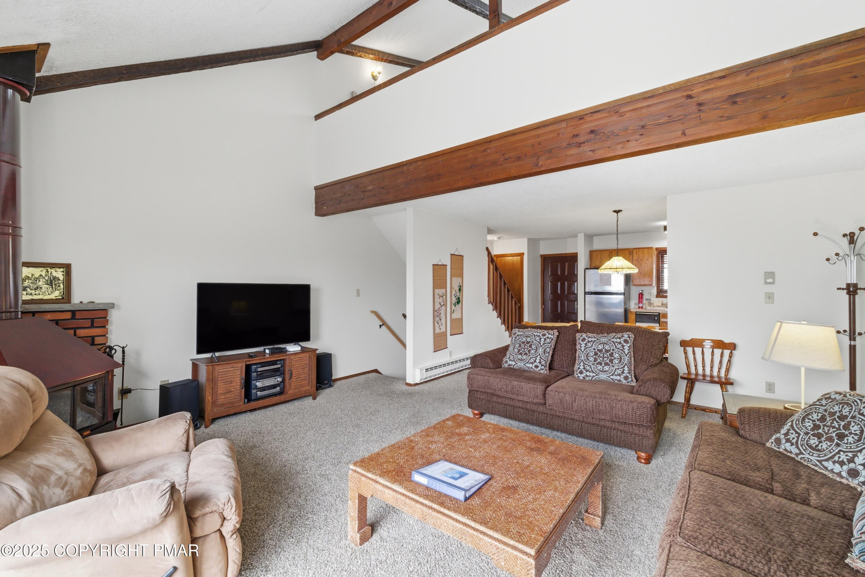 182 Upper Village Way Tannersville, PA 18372 - Photo 7 of 67 a living room with furniture and a flat screen tv